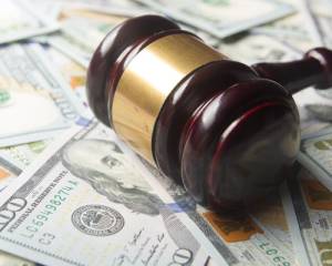 Gavel On Top Of Money