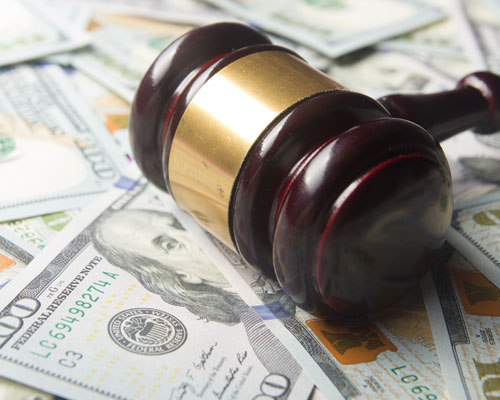 Gavel On Top Of Money
